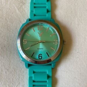 American eagle teal, with plastic flexible band.